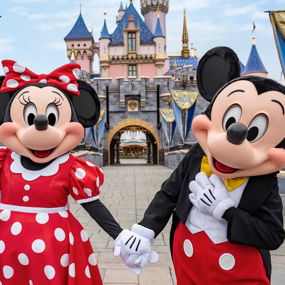 Mickey and Minnie in front of castle